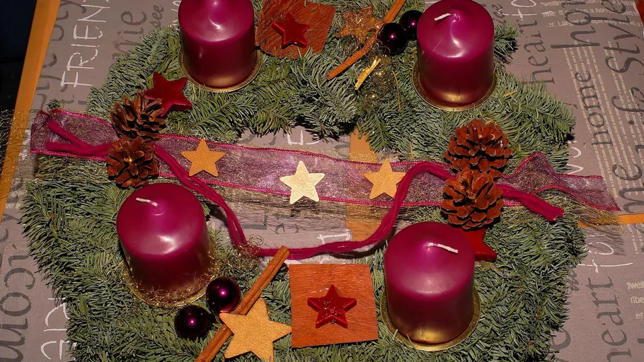 Advent wreath with four purple candles.