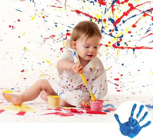 Child painting with colorful splatters.