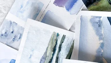 Several watercolor paintings laid on paper.