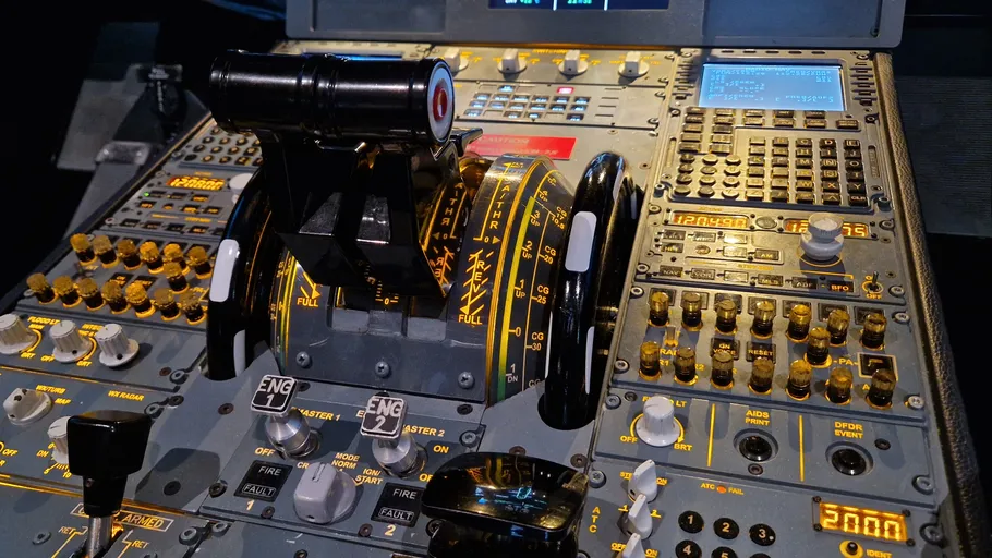 Airplane cockpit throttle levers and controls.