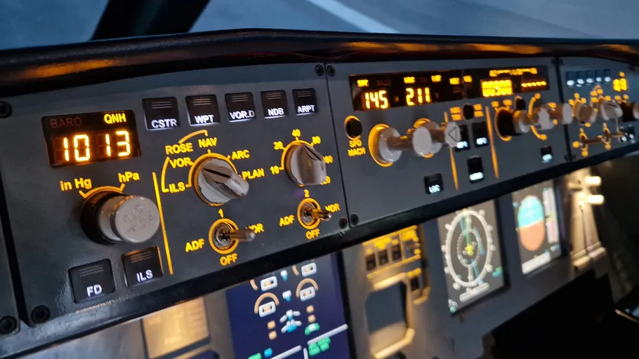 Aircraft cockpit control panel, buttons and displays.