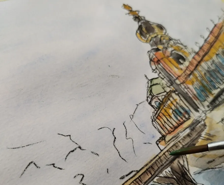 Watercolor painting of ornate building with paintbrush.