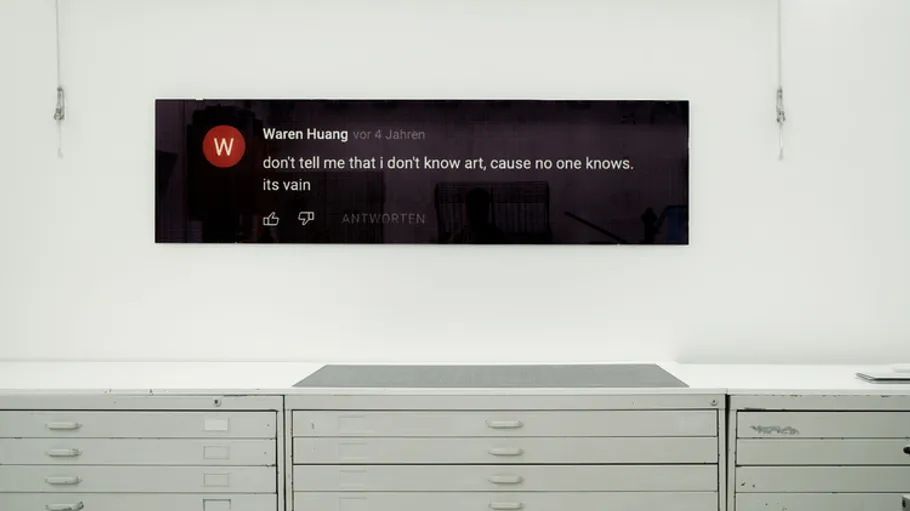 Digital comment displayed above drawers in gallery.