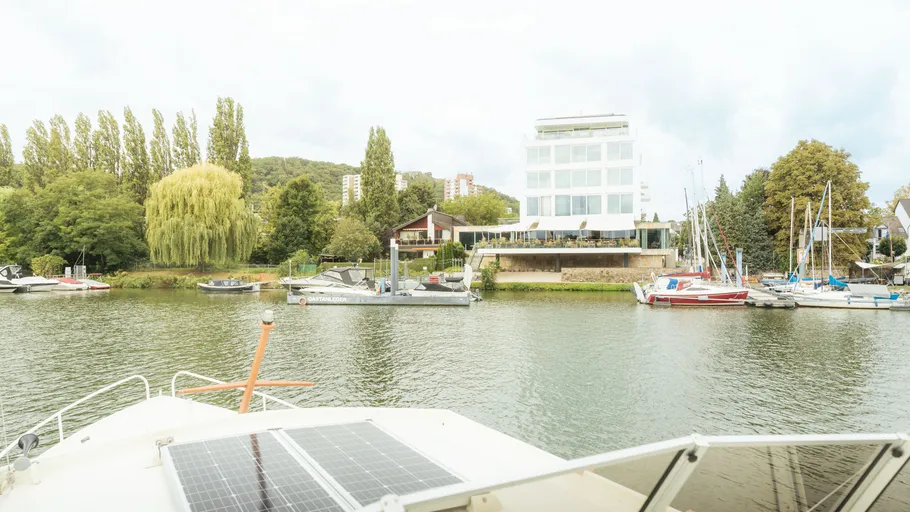 River with boats and modern building view.