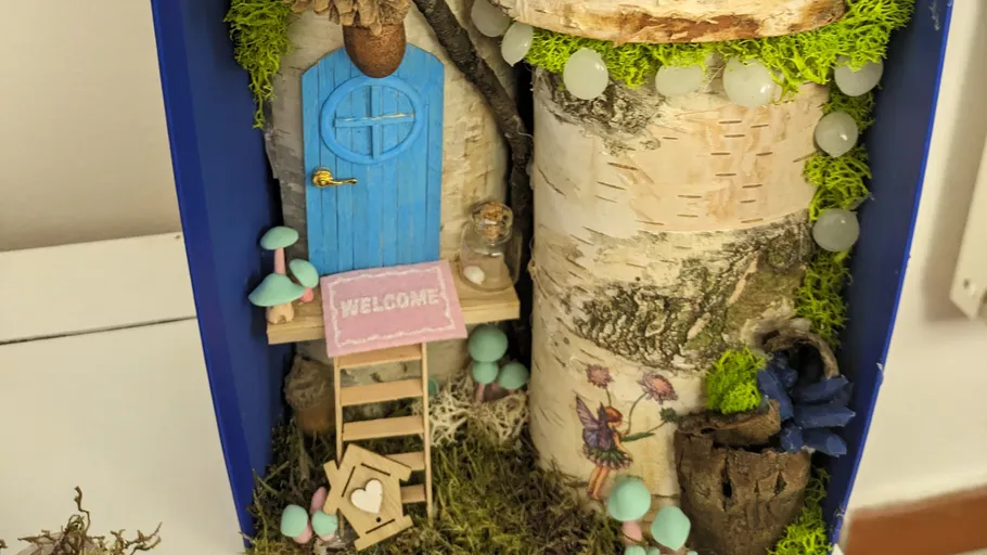 Fairy house with door and decorations.