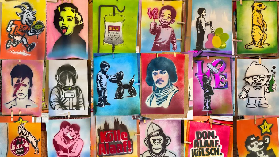 Colorful stenciled posters displayed on a wall.