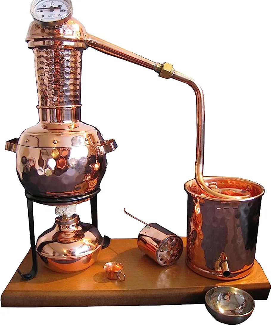 Copper distillation apparatus on a wooden base.