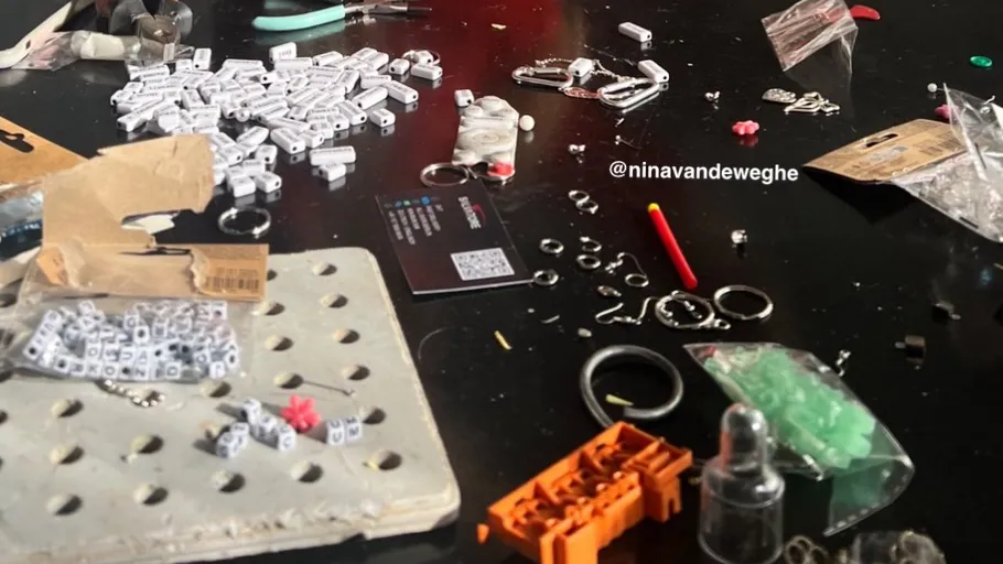 Crafting table with various jewelry components.
