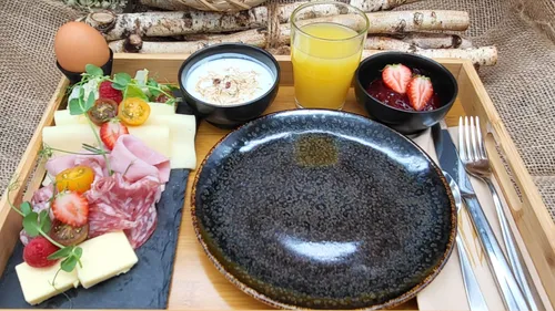 Breakfast platter with fruits, yoghurt, juice.