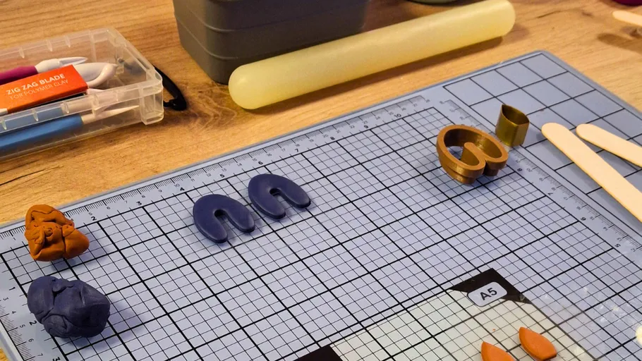 Crafting table with colorful clay and tools.