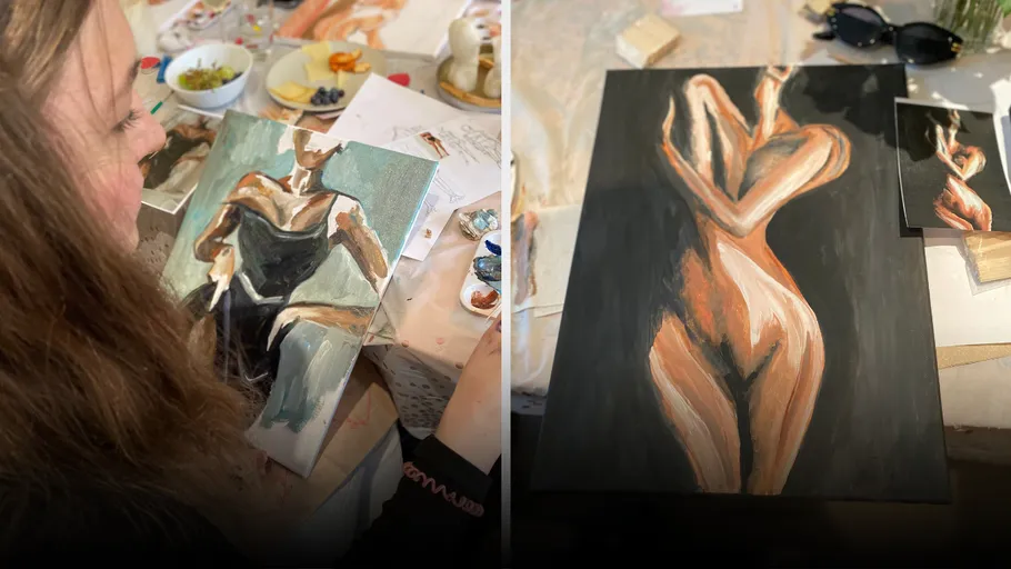 Woman painting, abstract figures on tables.