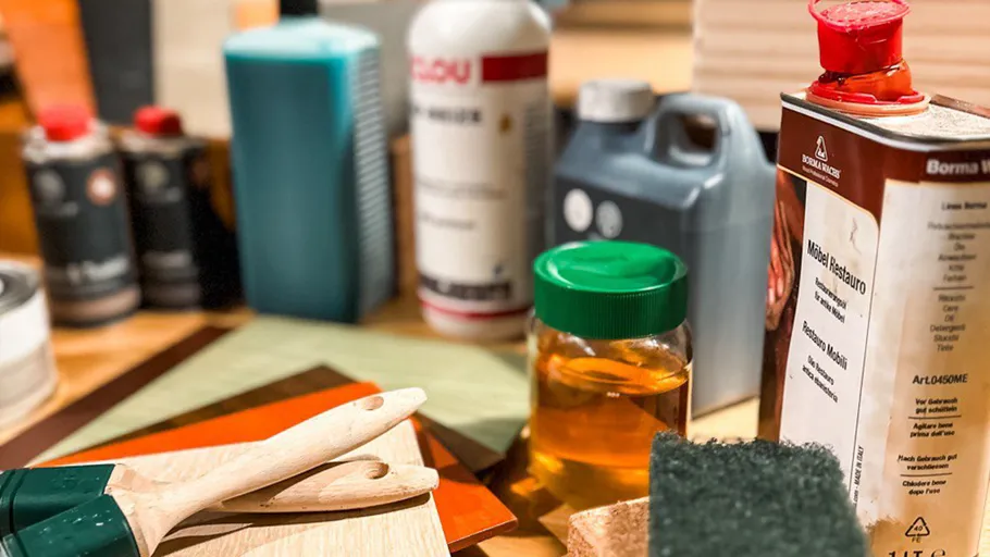 Various painting tools and supplies on a table.