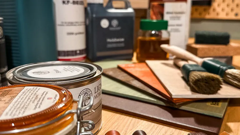 Wood finishing supplies on a wooden table.