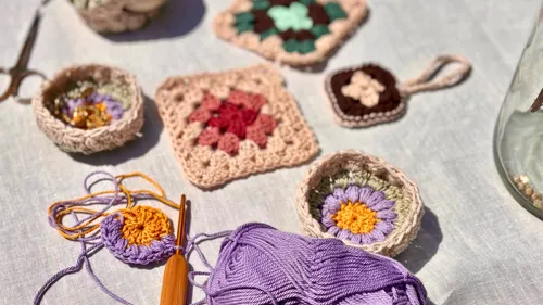 Crochet items on a light table background.