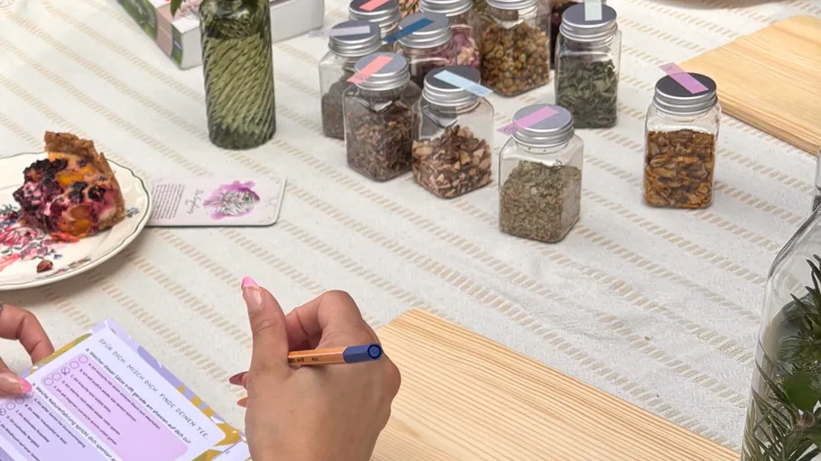 Person writing beside jars and pie slice.