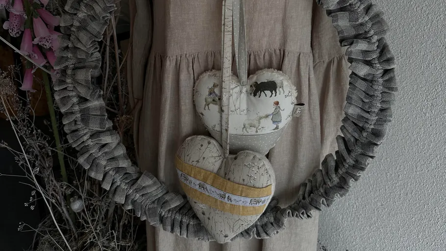 Fabric hearts hanging on a dress.