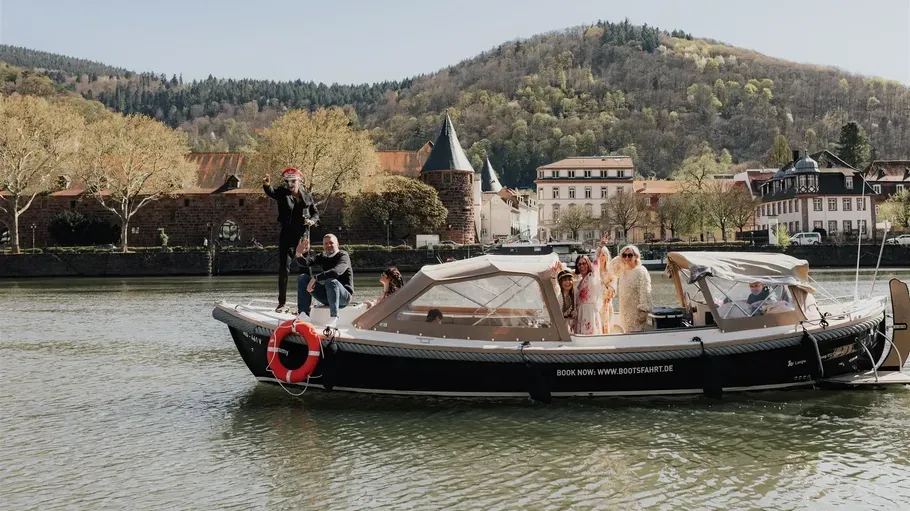 People on a boat in a scenic river.