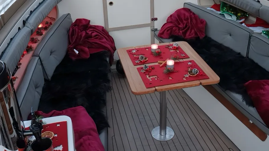 Boat interior decorated with Christmas items.