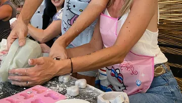 People making crafts with molds indoors.