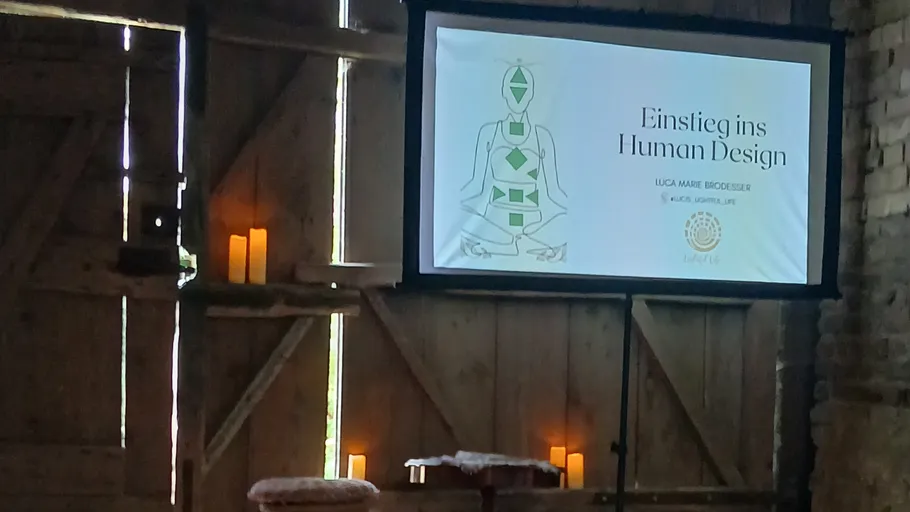 Slide presentation in dimly lit rustic room.