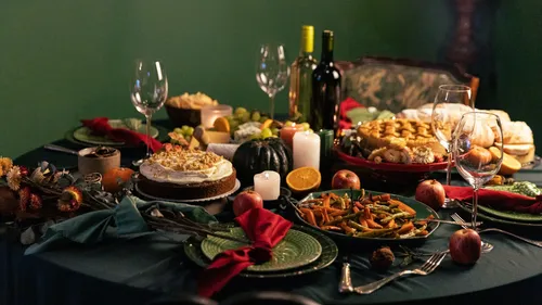 Festive dinner table with various dishes.