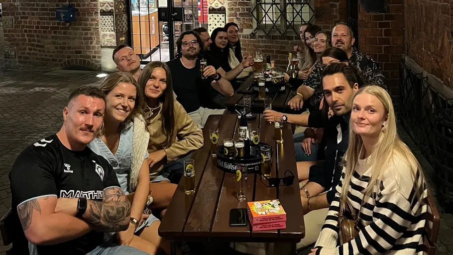 Group of people sitting at a restaurant table.