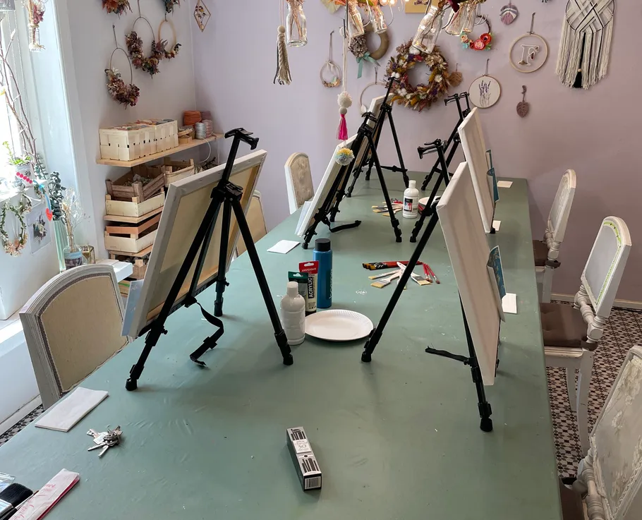 Art studio with easels on a table.