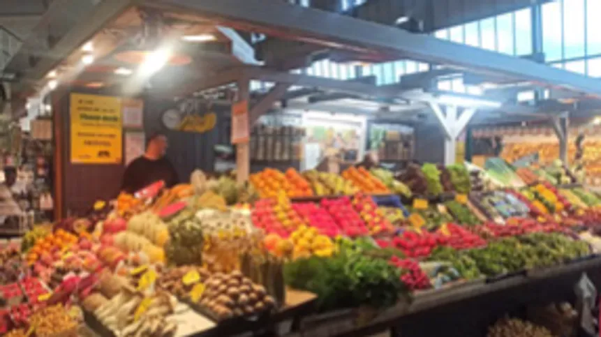 Market stall with colorful fruits and vegetables.