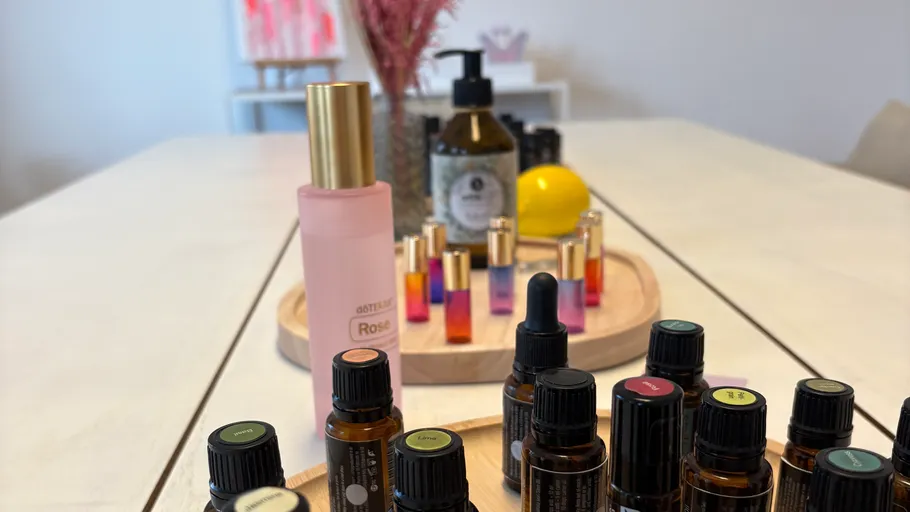 Aromatherapy bottles arranged on a wooden table.