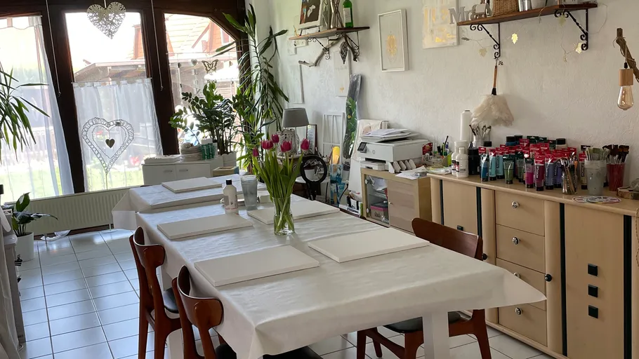Art studio with table set for painting.