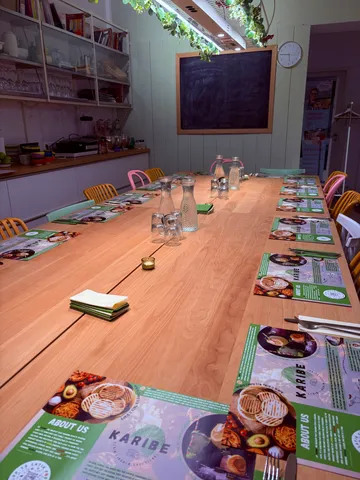 Dining room with long table and chairs.