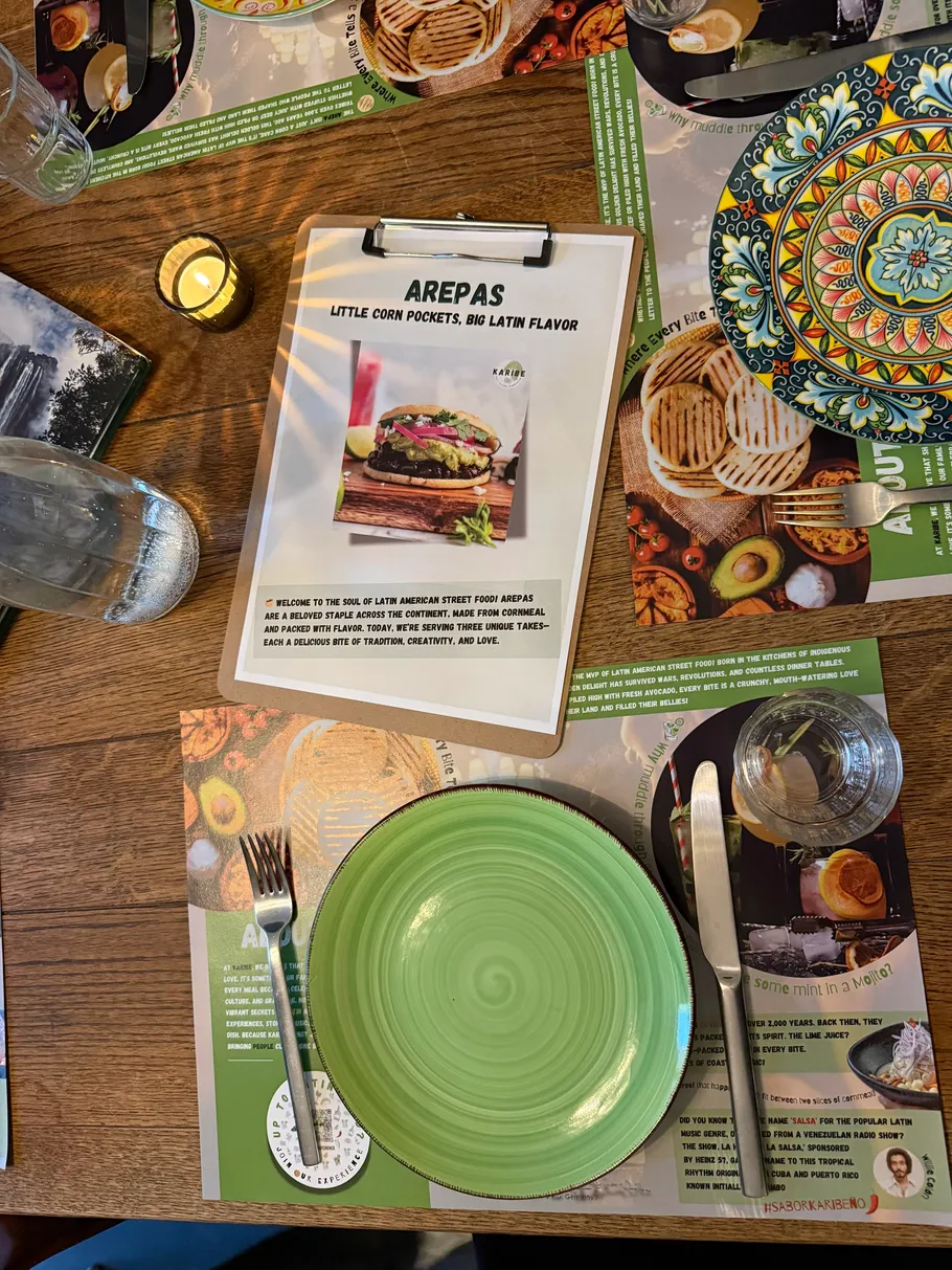 Table setting with menu, plate, and utensils.