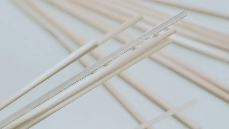 Close-up of wooden chopsticks on table.