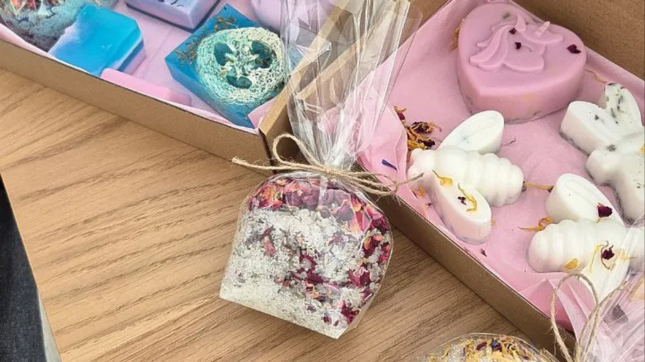 Colorful soaps and bath products on a table.