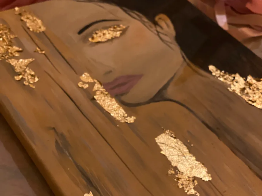 Portrait auf Holz mit Goldblattdetails.