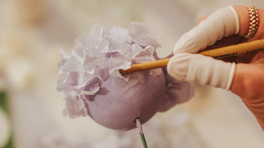 Hand painting purple flower craft project.