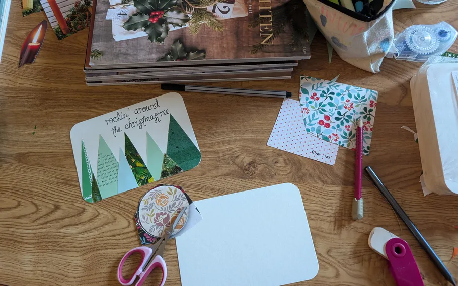 Crafting materials and tools on a wooden table.