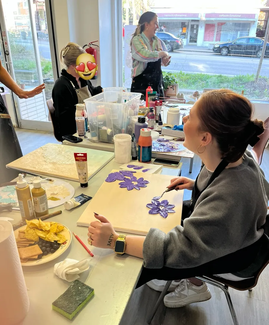 People painting in an art studio.