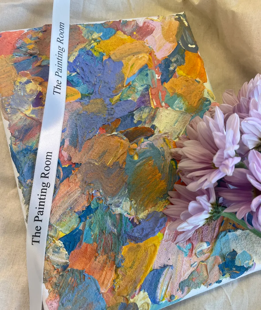 Colorful painting with flowers and ribbon.