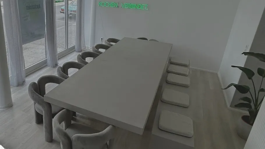 Long table and chairs in a modern room.