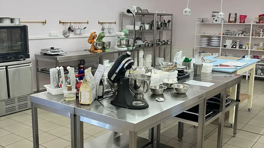 Kitchen interior with mixers on tables.