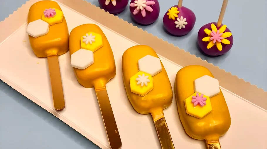 Colorful decorated desserts on a tray.