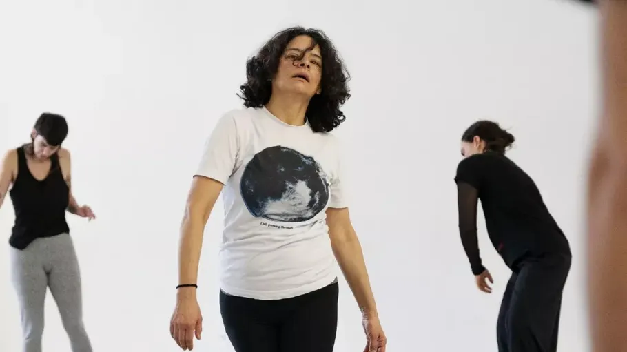 Three people dancing in a studio.