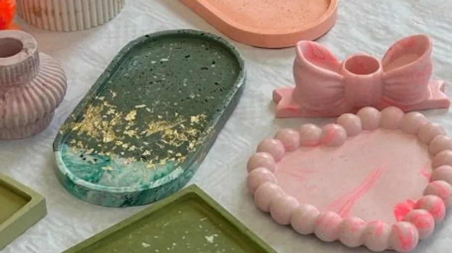 Decorative trays and vases on a table.