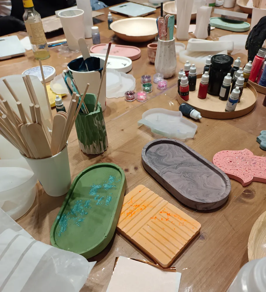 Art supplies on a wooden table.