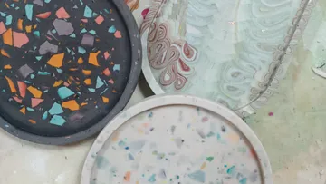 Four decorative trays with colorful patterns.
