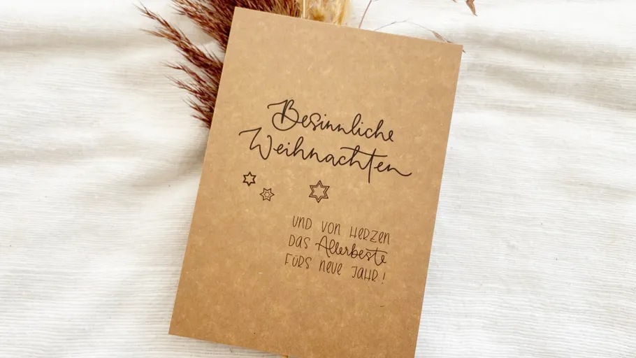 Brown greeting card with Christmas message.