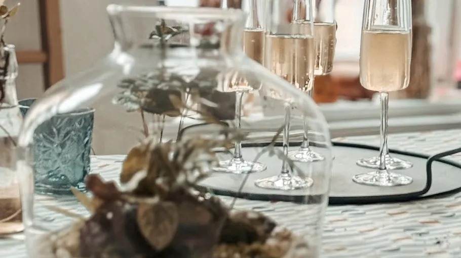Champagne glasses on table with decor.