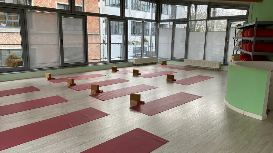 Yoga mats and blocks in a studio.