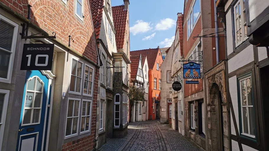 Historic narrow street with colorful buildings.